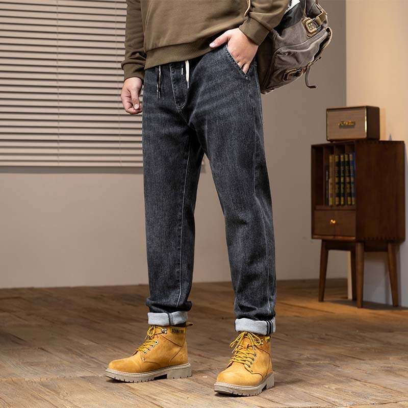 Muške traperice od denima, isprane, široki kroj, srednje visoki pojas, gusta tkanina, elastičnost