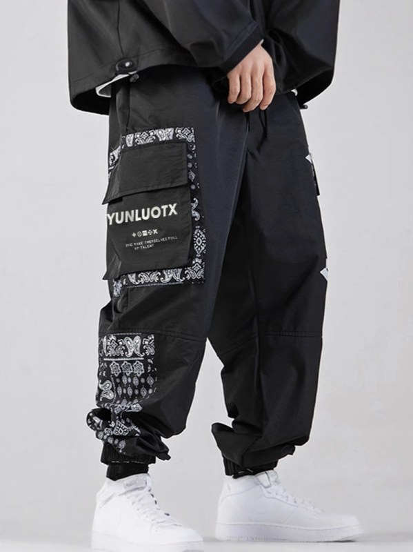 Sportske hlače u opuštenom kroju, brzo se sušećim materijalom, tanke tkanine, srednje visoki pojas, print dizajn za ljeto