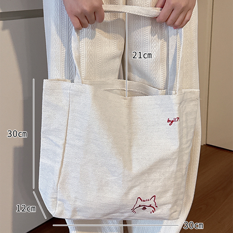 Csíkos vászon tote táska, fiatalos campus stílus, belső telefontartó zseb, dupla vállpánt, 2025 tavaszi kiadás