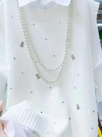 Női kötött mellény, V-nyakú, ujjatlan, egyszínű, őszi 2025