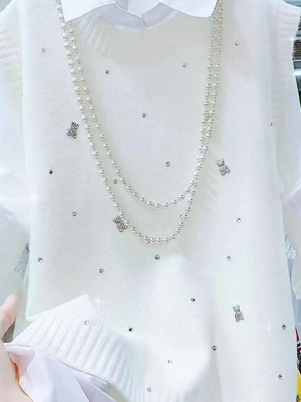 Női kötött mellény, V-nyakú, ujjatlan, egyszínű, őszi 2025