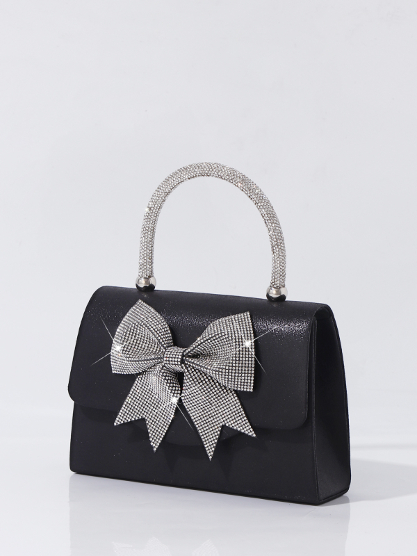 Gyémánttal díszített masnival készült estéti kézitáska, boríték-stílusú, vízszintes négyzetes forma, fedél nyitás, belső dokumentumrekesz.