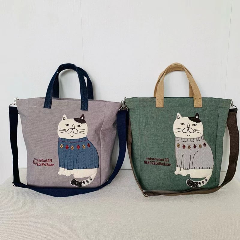 Ukrašena crossbody torba za gradske potrebe — platno, zatvarač, poliester podstava.