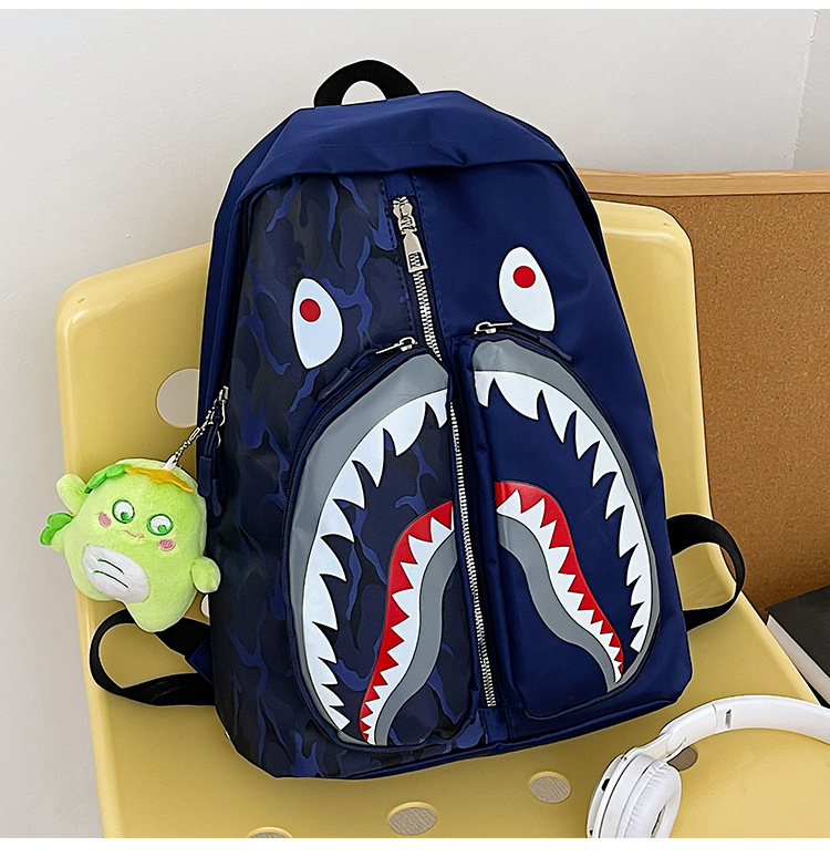 Ženski ruksak u street styleu s grafikom ajk graffita, velik kapacitet za učenike i studente (Nylon; vodootporan; zatvarač; džep za laptop; unutarnji džepovi za telefon, ID i kameru)