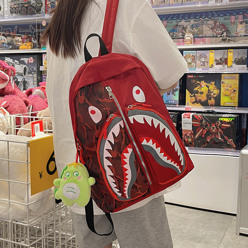 Ženski ruksak u street styleu s grafikom ajk graffita, velik kapacitet za učenike i studente (Nylon; vodootporan; zatvarač; džep za laptop; unutarnji džepovi za telefon, ID i kameru)