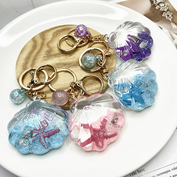 Akril kulcstartó folyékony tengeri mini tájjal – tengeri csillag egy üvegben gyorshomokkal