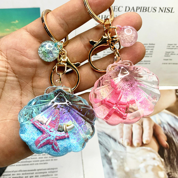 Akril kulcstartó folyékony tengeri mini tájjal – tengeri csillag egy üvegben gyorshomokkal