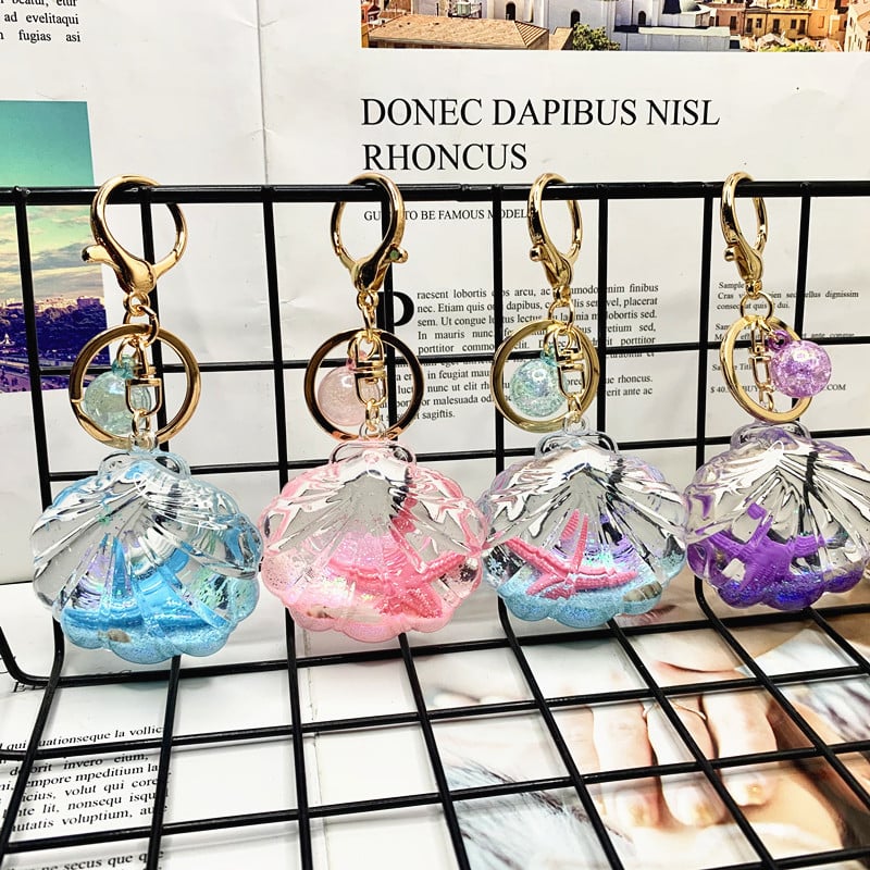 Akril kulcstartó folyékony tengeri mini tájjal – tengeri csillag egy üvegben gyorshomokkal