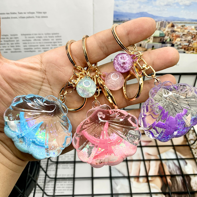 Akril kulcstartó folyékony tengeri mini tájjal – tengeri csillag egy üvegben gyorshomokkal