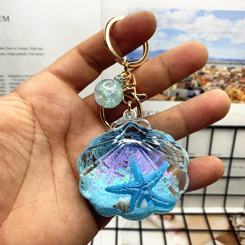 Akril kulcstartó folyékony tengeri mini tájjal – tengeri csillag egy üvegben gyorshomokkal