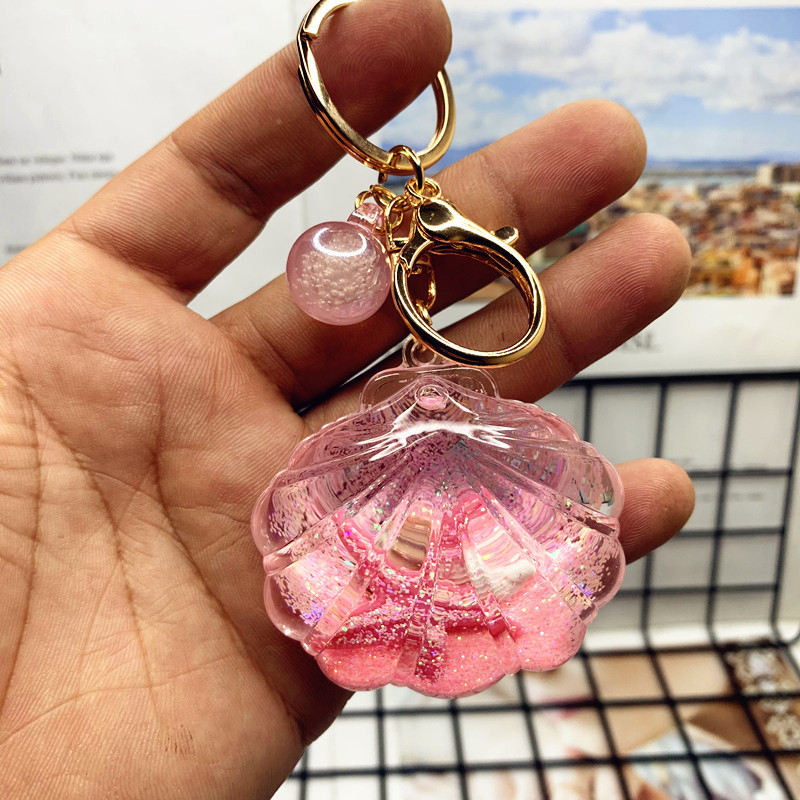 Akril kulcstartó folyékony tengeri mini tájjal – tengeri csillag egy üvegben gyorshomokkal