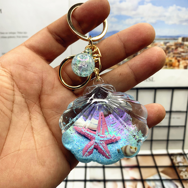 Akril kulcstartó folyékony tengeri mini tájjal – tengeri csillag egy üvegben gyorshomokkal