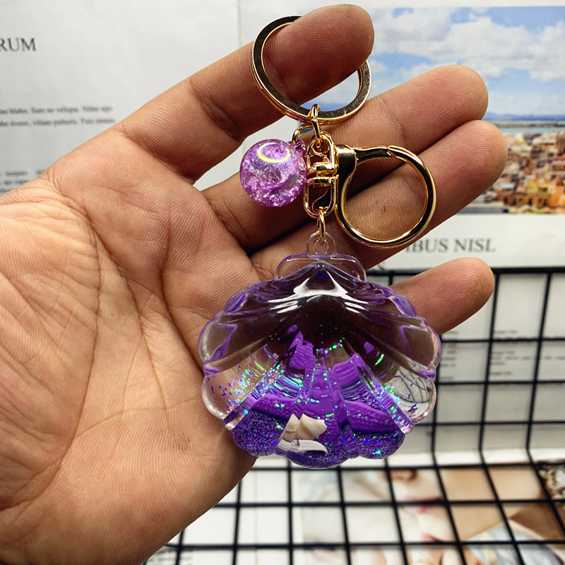 Akril kulcstartó folyékony tengeri mini tájjal – tengeri csillag egy üvegben gyorshomokkal