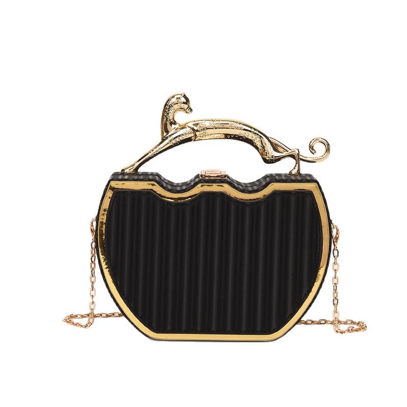 PU doboztáska, láncos vállpánt, kör alakú formájú, zárható, laminált belső cipzáras rekesz