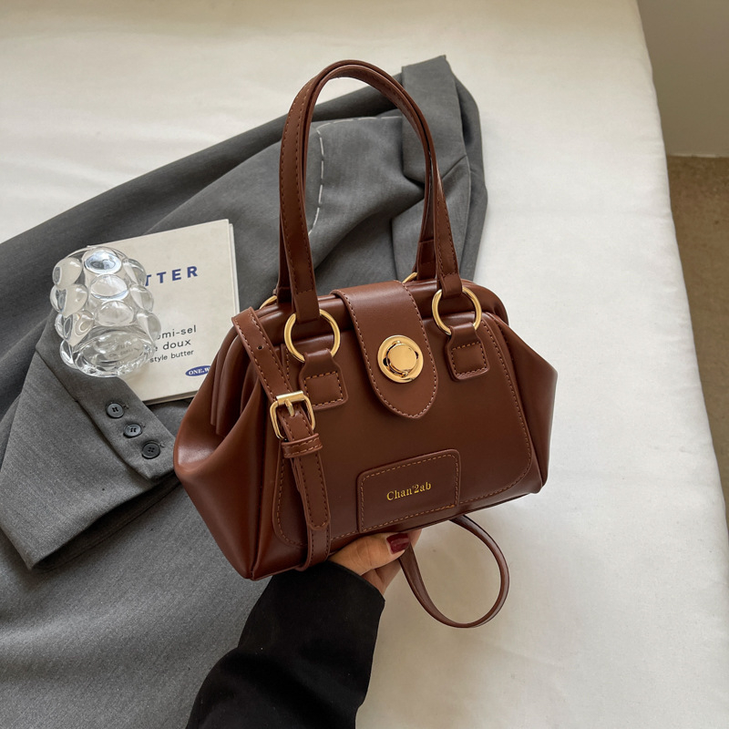 PU bucket torbica, street style, pravokutnog oblika, zatvarač s latch mehanizmom, poliester podstava, džep za telefon, jedna naramenica, za svakodnevnu upotrebu