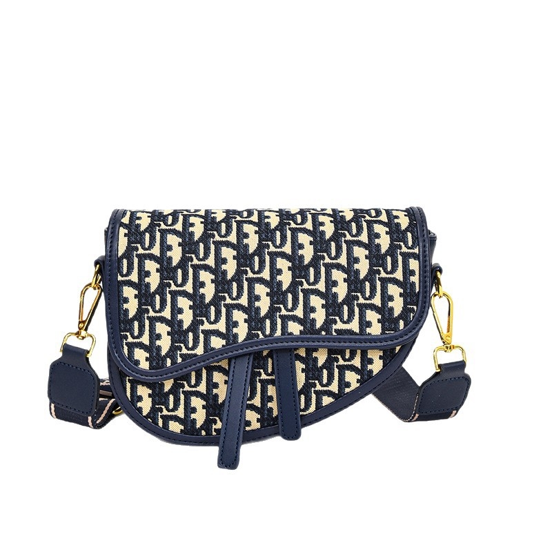 PU bőrű közepes méretű nyerges táska hímzett mintával, kerek forma, cipzár, dupla vállpánt