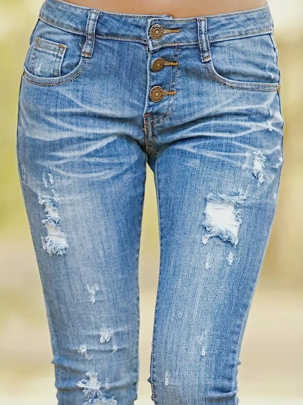 Traperice od denima, bootcut zapadnjačkog stila, nizak struk, blago proširene, pamuk 50–70%, poliester ispod 30%