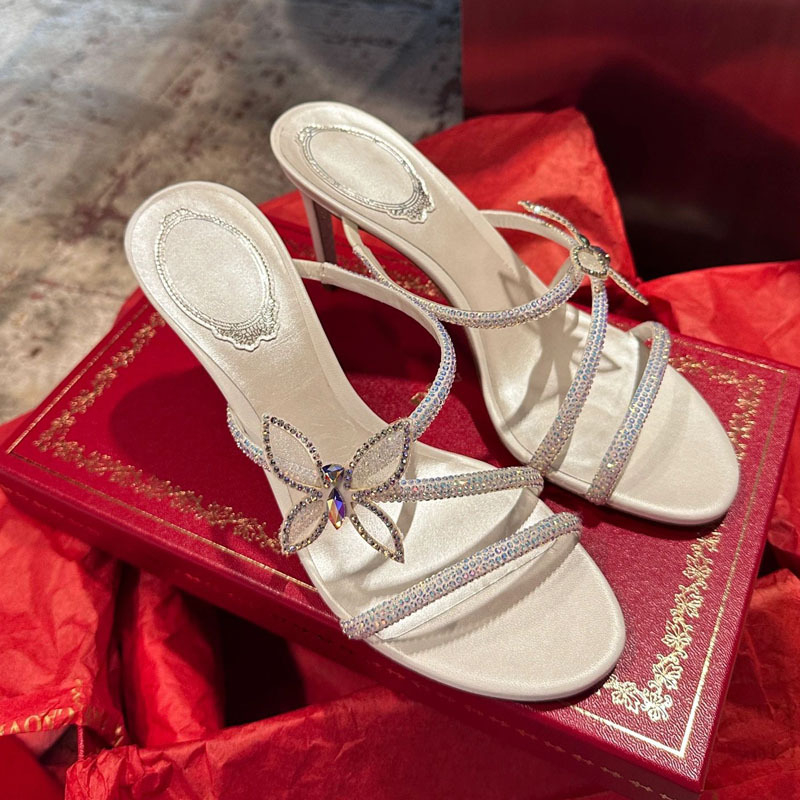 Rhinestone szandálok masnis-keresztezett pántokkal, nyitott orrú, stilettó magas sarkú, mikroszálas felsőrész