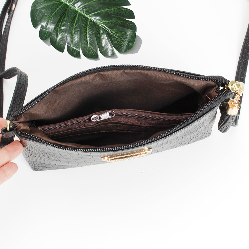 Ženska PU crossbody torba — mala kvadratna, zip zatvaranje, horizontalan oblik, unutarnji džepovi: džep sa zipom i džep za telefon