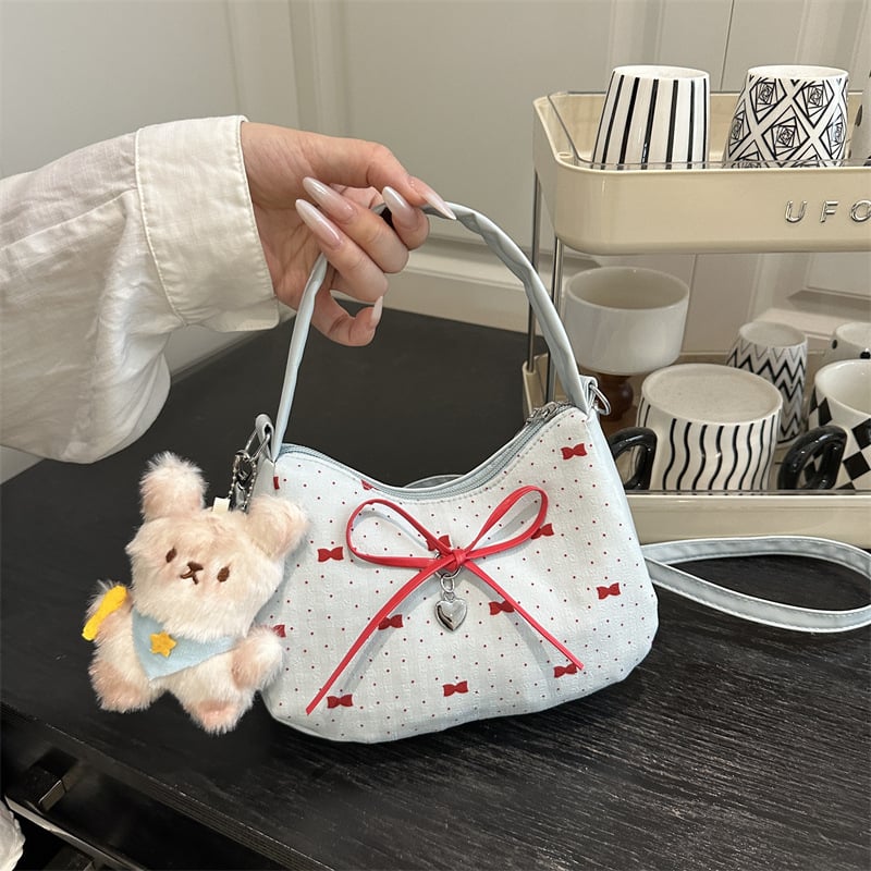 Crossbody torba s mašnicom, gradski stil, horizontalni kvadratni oblik, zatvaranje na zip, poliesterska podstava