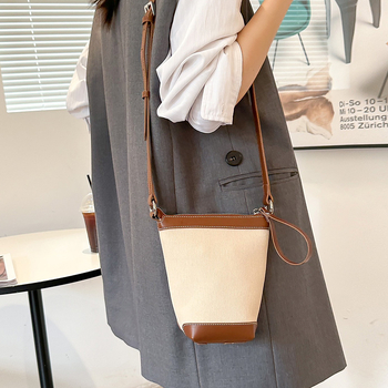 Ženska PU bucket torba, gradski minimalistički stil, proljeće 2025, svakodnevna torba za rame ili crossbody.