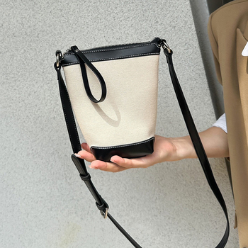 Ženska PU bucket torba, gradski minimalistički stil, proljeće 2025, svakodnevna torba za rame ili crossbody.