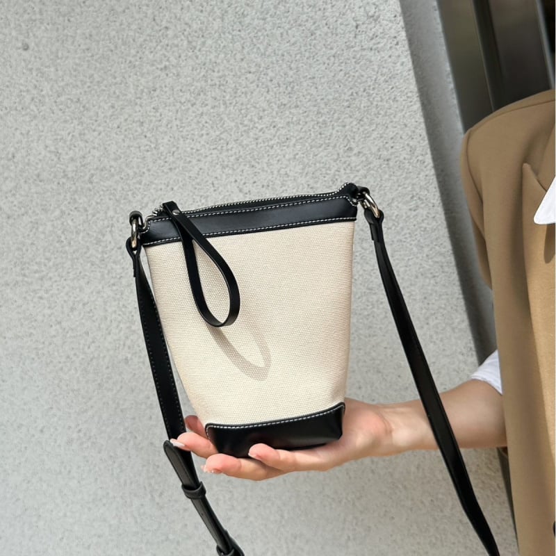 Ženska PU bucket torba, gradski minimalistički stil, proljeće 2025, svakodnevna torba za rame ili crossbody.