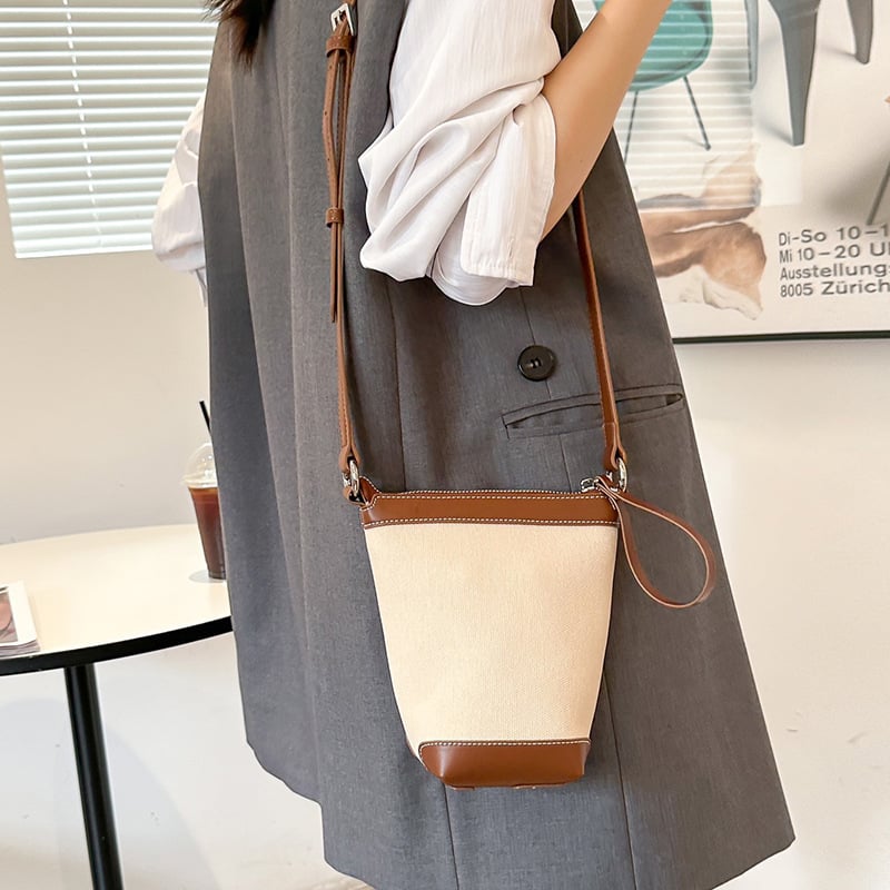 Ženska PU bucket torba, gradski minimalistički stil, proljeće 2025, svakodnevna torba za rame ili crossbody.