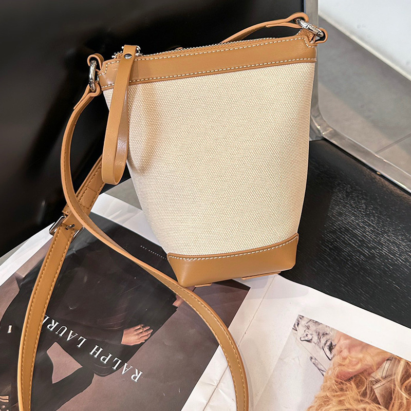 Ženska PU bucket torba, gradski minimalistički stil, proljeće 2025, svakodnevna torba za rame ili crossbody.