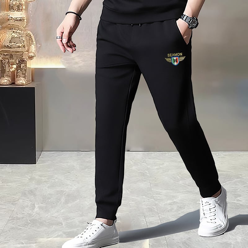 Férfi melegítőnadrág fleece-béléssel és rhinestone díszítéssel, karcsú szabás, középmagas derekú, 65% pamut