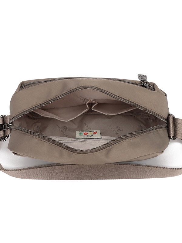 Ženska crossbody torba, tekstilni materijal, urban minimalistički stil, horizontalni kvadratni oblik, zatvarač, džep za telefon