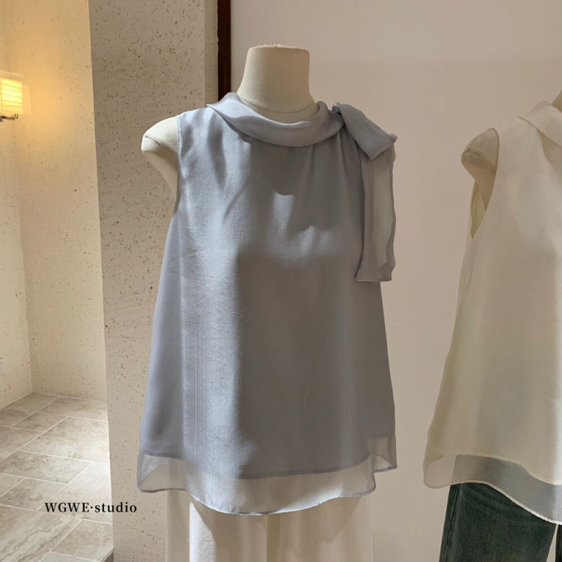 Šifon bluza, poliester 70–80%, okrugli izrez, bez rukava, slobodan kroj