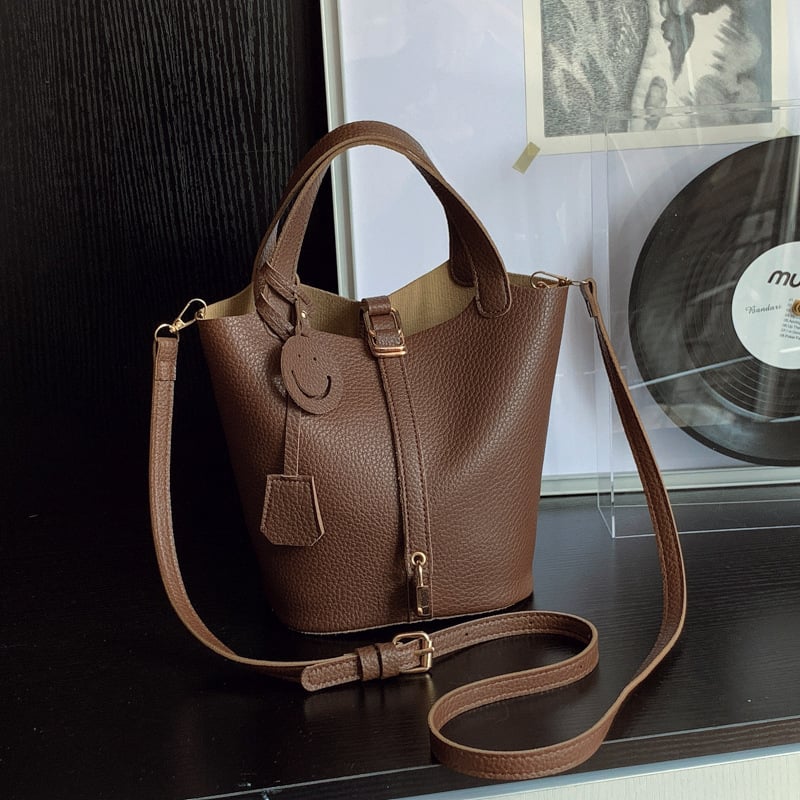 Ženska bucket torba, gradski minimalistički stil, PU materijal, kopčano zatvaranje, jedan remen