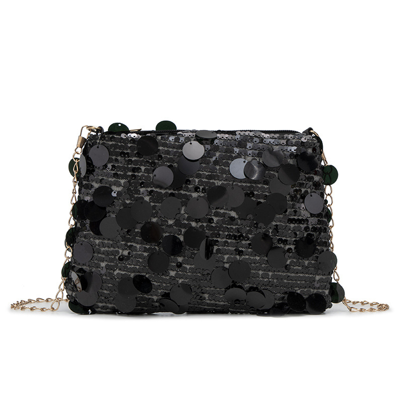 Lančana torbica preko ramena sa šljokicama - Materijal: poliester; Podstava: poliester; Otvaranje: zatvarač; Oblik: vodoravni kvadrat; Godina/Sezona: proljeće 2025