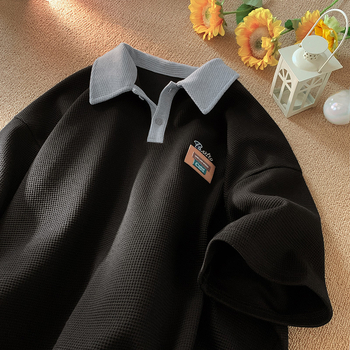 Póló felső rövid ujjú, laza szabás, poliészter anyag hímzett részlettel