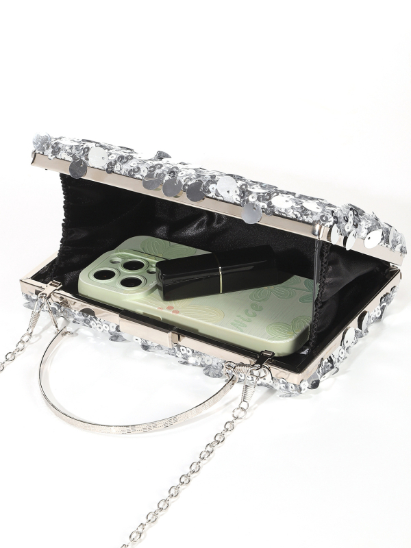 Clutch s šljokicama, horizontalni četverokutni oblik, mala večernja torbica; unutarnja podstava od poliestera; unutarnji džep za telefon; zatvaranje klipsom.
