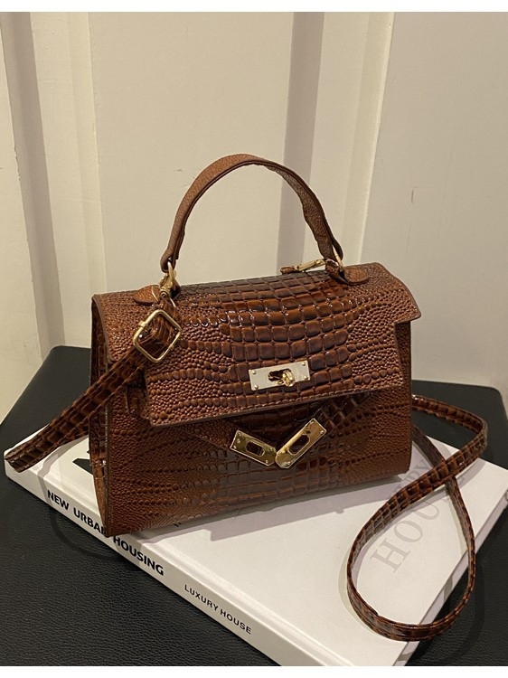 Crossbody torbica s francuskim stilom i teksturiranim izgledom — PU materijal, horizontalni kvadratni oblik, zaključavanje, podstava od sintetičke kože, ulični stil