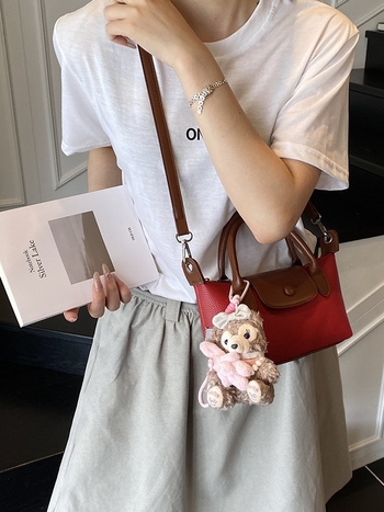 Crossbody torba, gradski minimalistički stil, PU koža, dumpling-tip oblik, otvaranje s poklopcem, poliester podstava