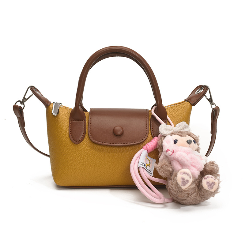 Crossbody torba, gradski minimalistički stil, PU koža, dumpling-tip oblik, otvaranje s poklopcem, poliester podstava