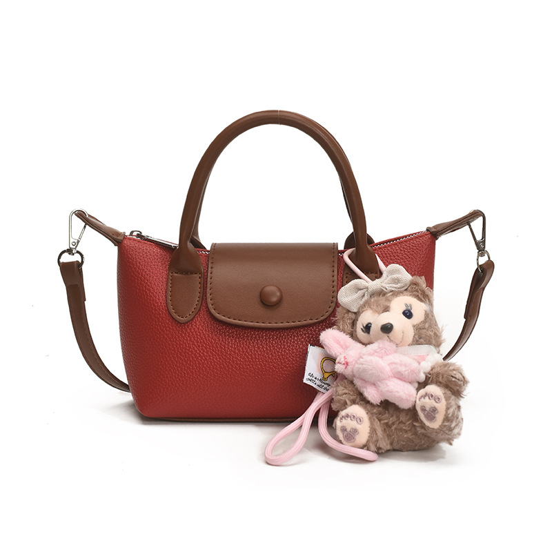 Crossbody torba, gradski minimalistički stil, PU koža, dumpling-tip oblik, otvaranje s poklopcem, poliester podstava