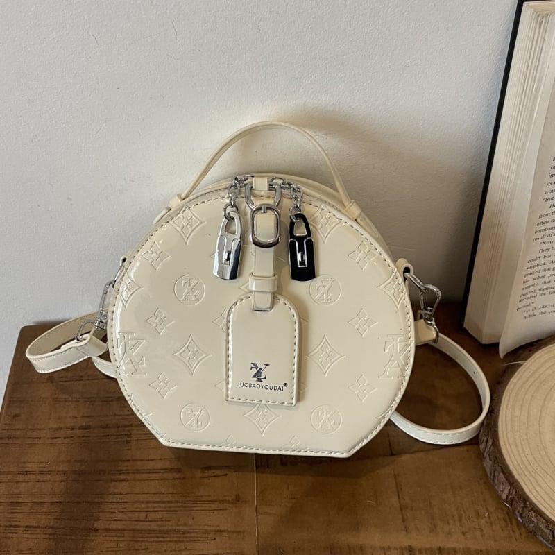 Ženska kružna crossbody torba — gradski minimalistički stil, PU materijal, zatvarač, džep za telefon