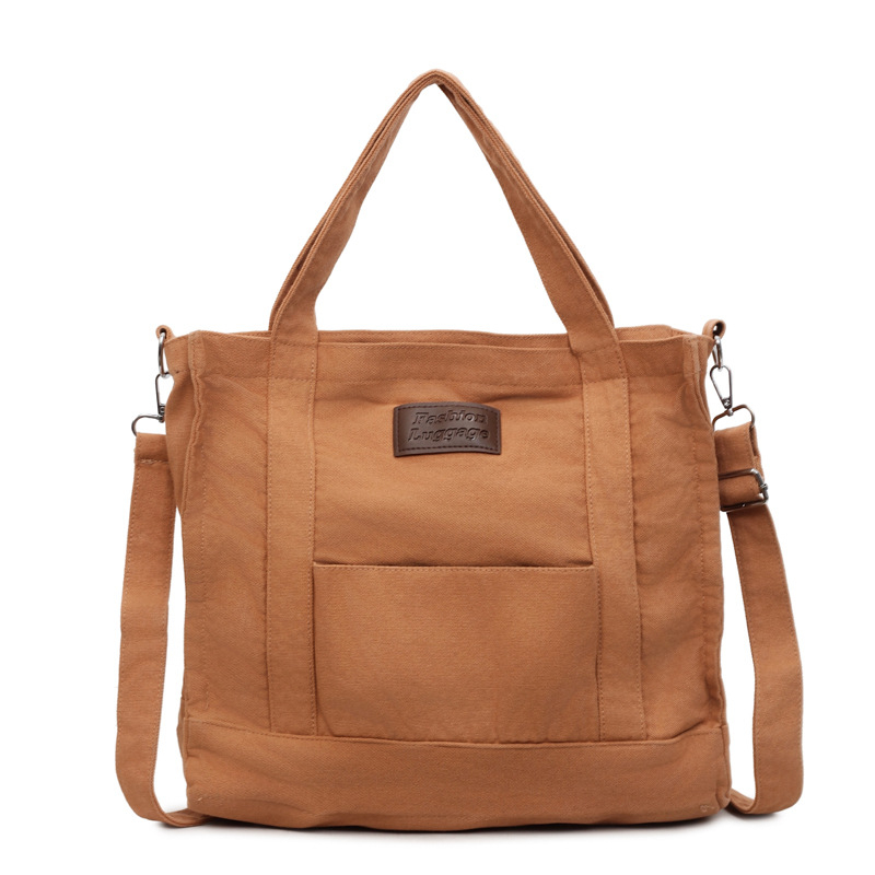 Platnena crossbody torbica u urbanom minimalističkom stilu, sa zatvaračem, džepom za telefon, bez podstava, s jednim remenom