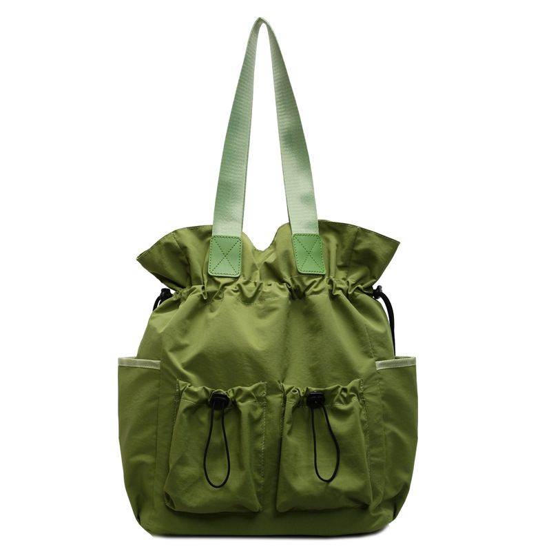 Najlon dama torba, tip kofera s naborima, zatvaranje šnuralom, unutarnji džepovi, dvostruke naramenice