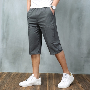 Férfi nyári pamut capri nadrágok sok zsebbel, laza szabás, rövid, alacsony derék, zsinóros zárás