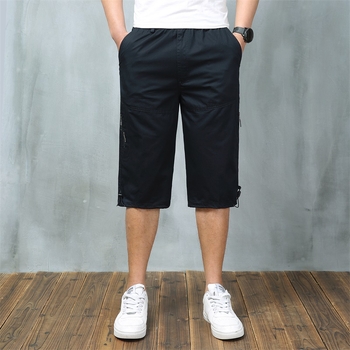 Férfi nyári pamut capri nadrágok sok zsebbel, laza szabás, rövid, alacsony derék, zsinóros zárás