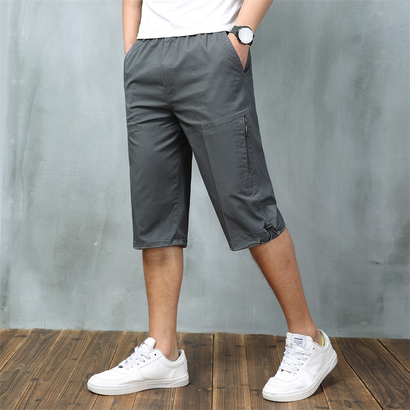 Férfi nyári pamut capri nadrágok sok zsebbel, laza szabás, rövid, alacsony derék, zsinóros zárás
