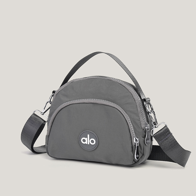 Ženska mala okrugla crossbody torbica — platno, unutarnji džepovi za telefon, dokumente i džep s zatvaračem, podstava od poliestera