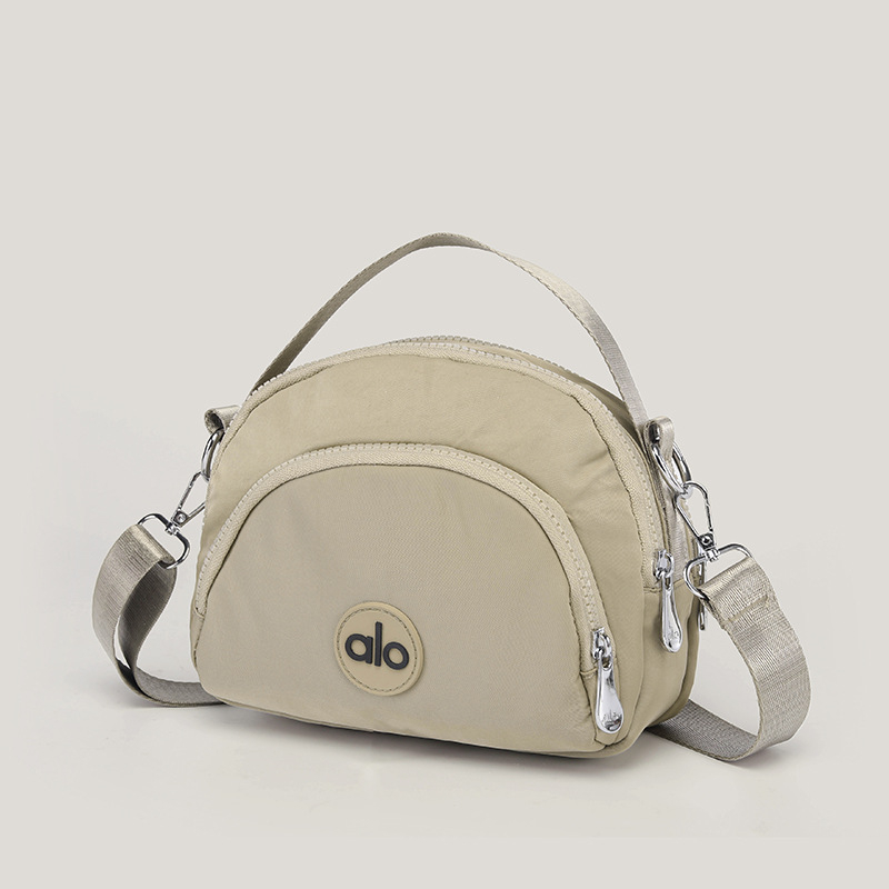 Ženska mala okrugla crossbody torbica — platno, unutarnji džepovi za telefon, dokumente i džep s zatvaračem, podstava od poliestera