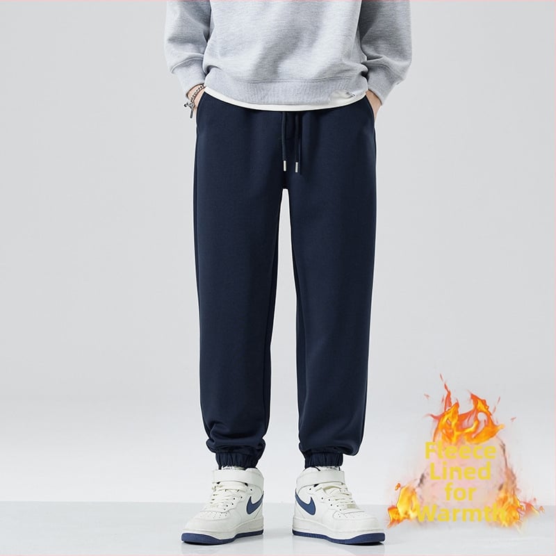 Férfi melegítő nadrág fleece béléssel, vastagított, lazább szabás, húzózsinórral, 63% pamut / 37% poliészter