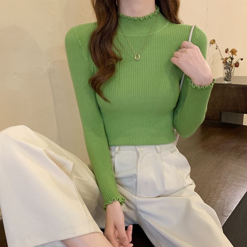 Női kötött pulóver fél magas gallérral, fleece béléssel, gyapjú alapanyagú és nyúl szőrmés részletekkel, közepes vastagság